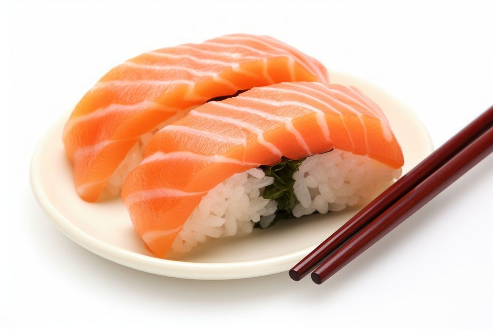 Chopsticks with Salmon sushi nigiri salmon seafood plate.