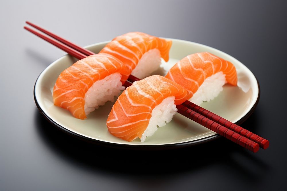 Chopsticks seafood salmon sushi.