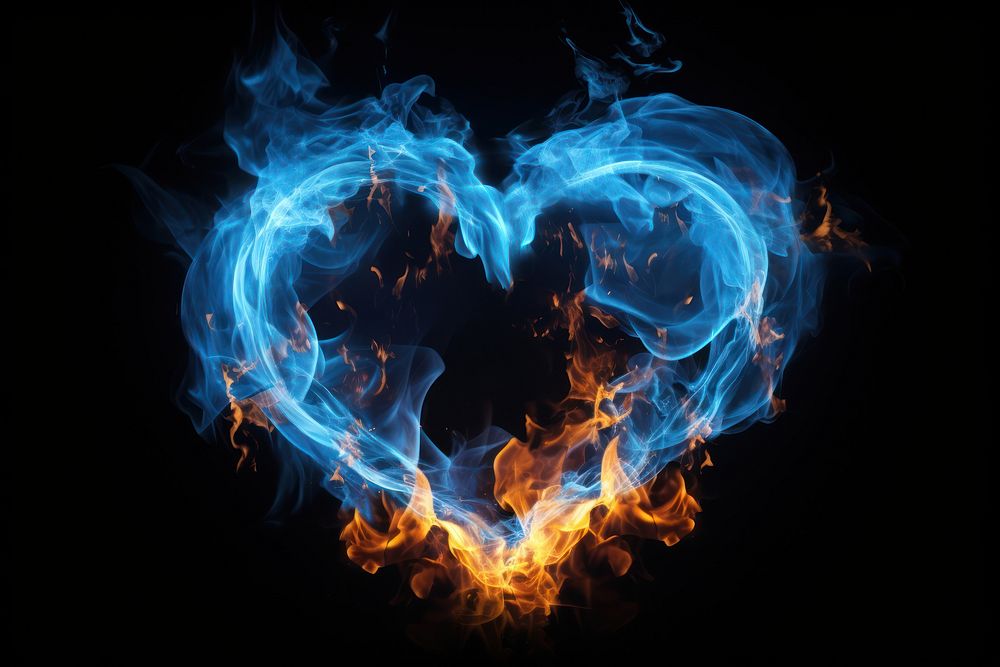 Photo blue fire in heart shape burning pattern smoke.