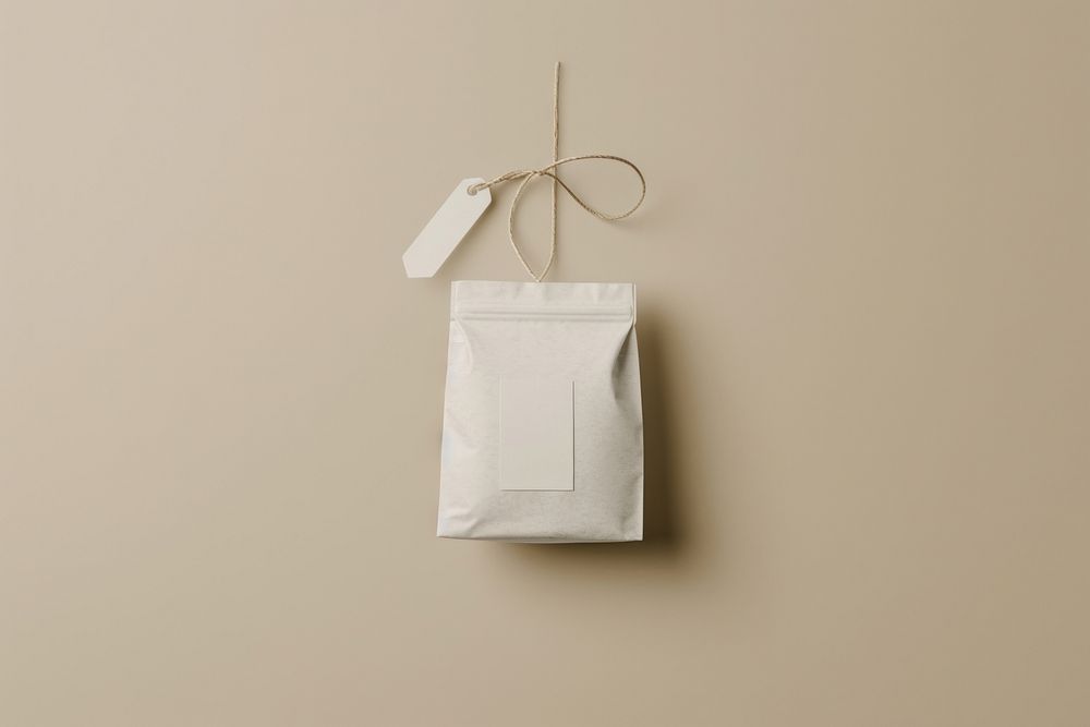 Mockup whiyte tea bag lighting origami ribbon.