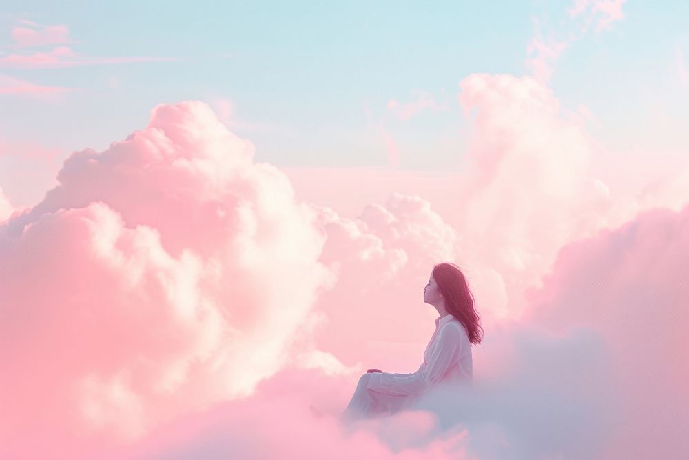 Photo of a girl sitting cloud sky outdoors.