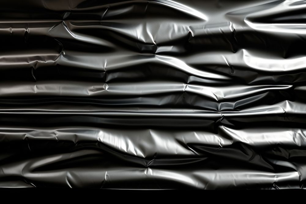 Black plastic wrap backgrounds transportation repetition.