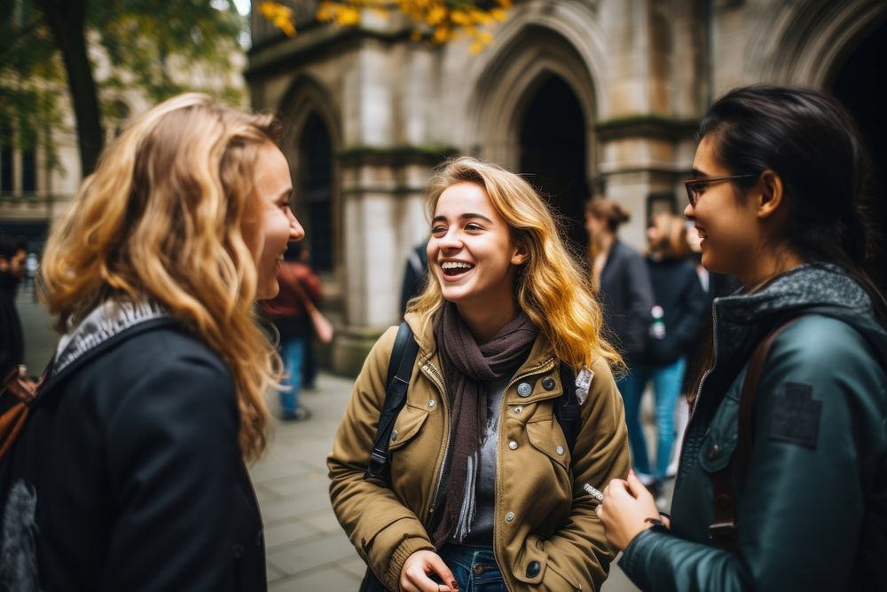 Photo of young people laughing talking adult.
