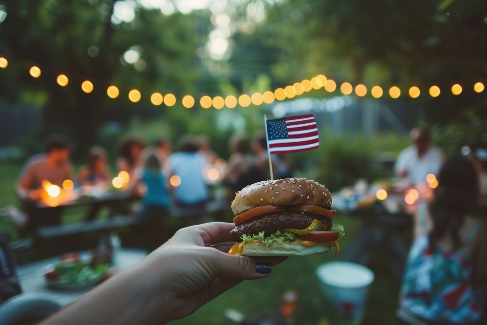 Burger with usa flag holding party adult.