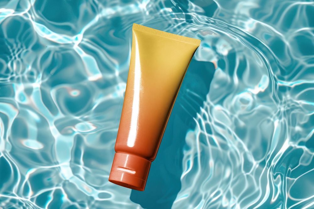 Gradient cream tube floating in pool