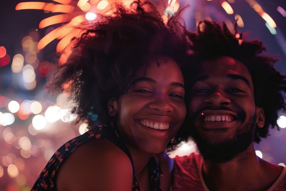 Couple smileing and talking fireworks laughing portrait.