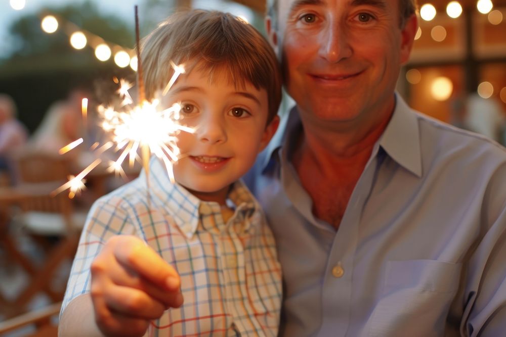 Boy and dad holding sparkler portrait sparks adult.