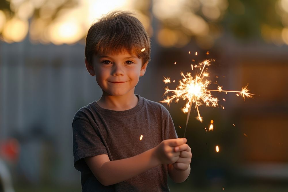 Boy holding sparkler sparks child | Premium Photo - rawpixel