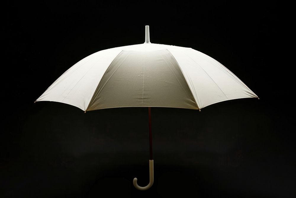 White umbrella black background protection sheltering.
