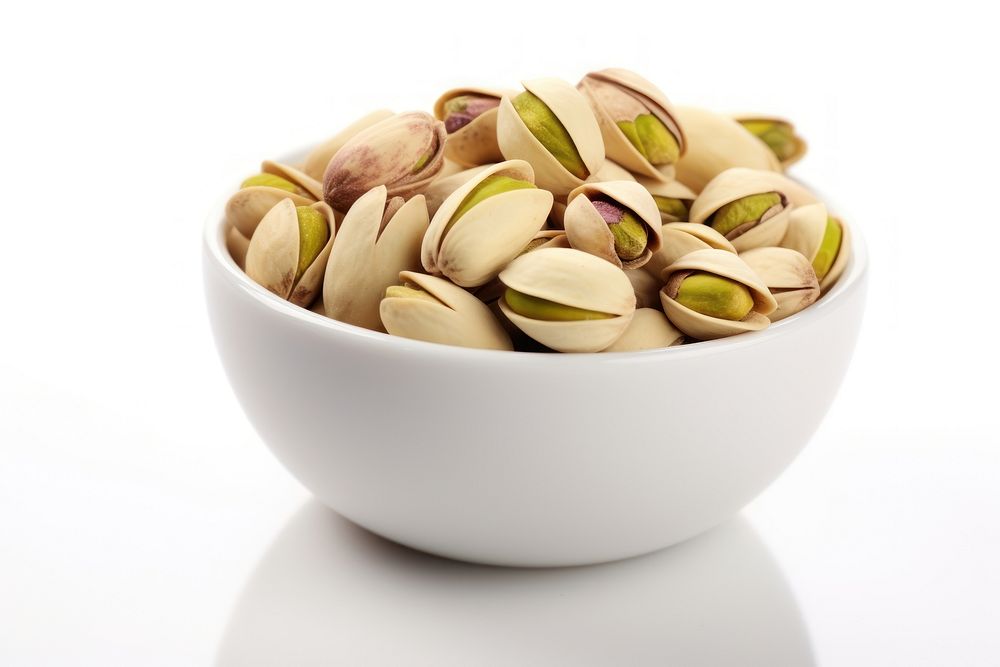 Pistachio nuts in bowl vegetable plant food.