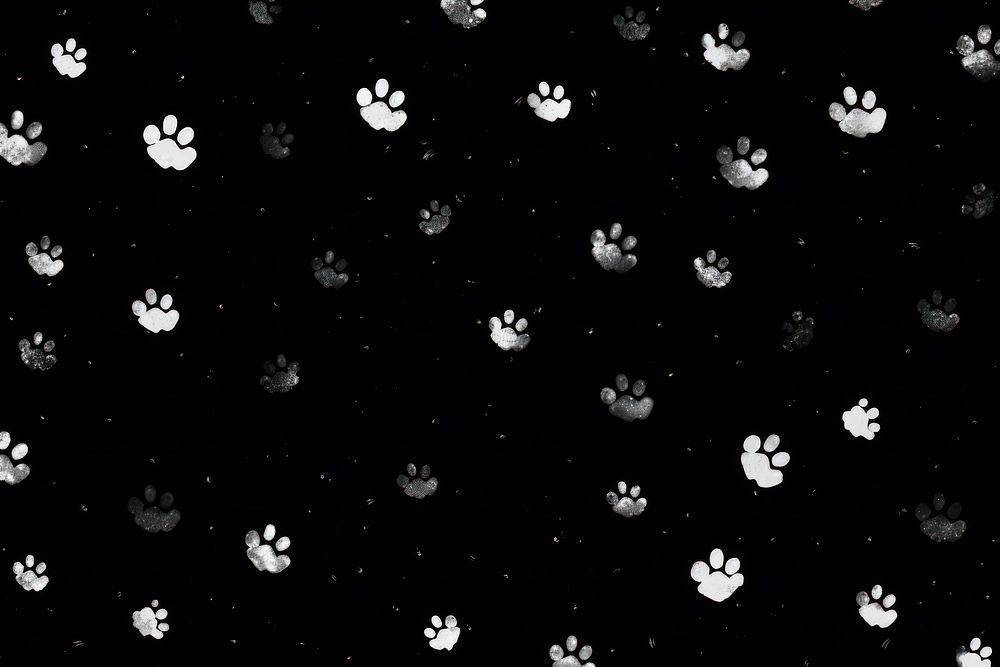Cat paws pattern backgrounds black.