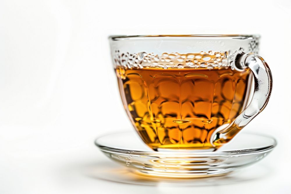 A cup of Hot tea saucer drink glass.
