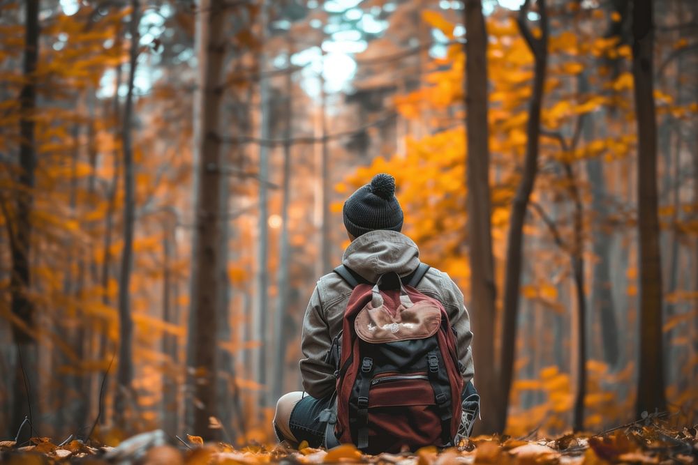 Young adults hiker autumn landscape backpack.