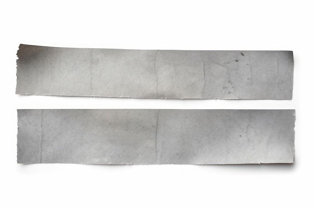 Grey adhesive strip backgrounds rough white.