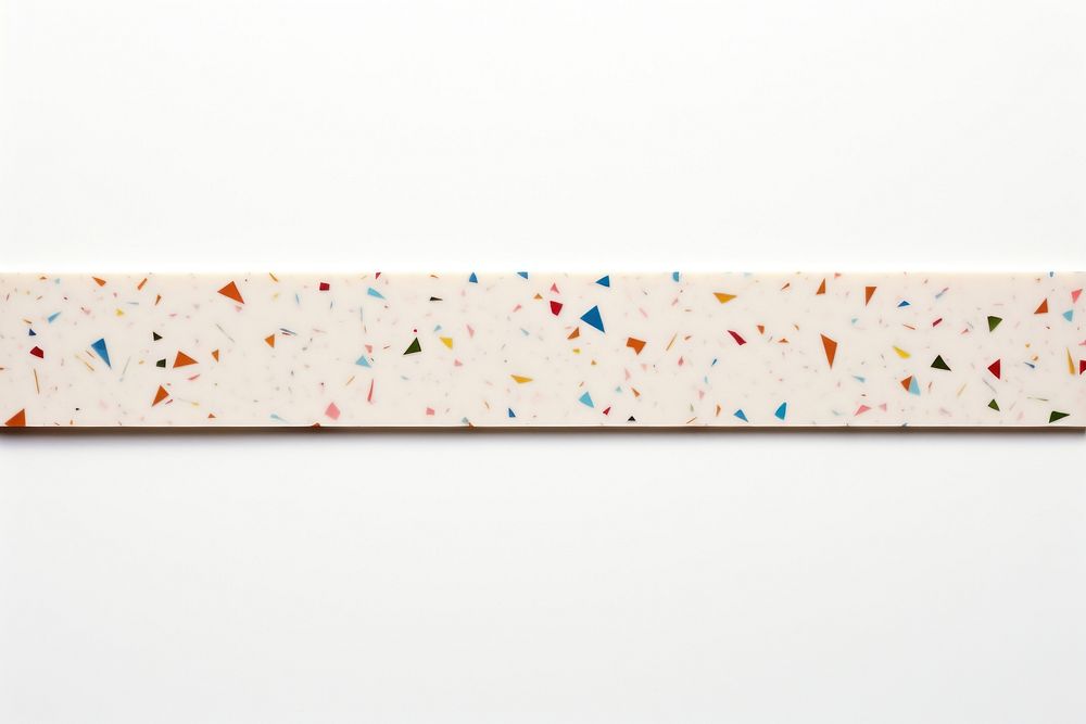 Terrazzo adhesive strip white background rectangle sprinkles.