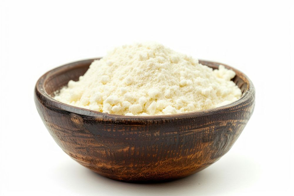 A bowl of semolina flour powder food white background.