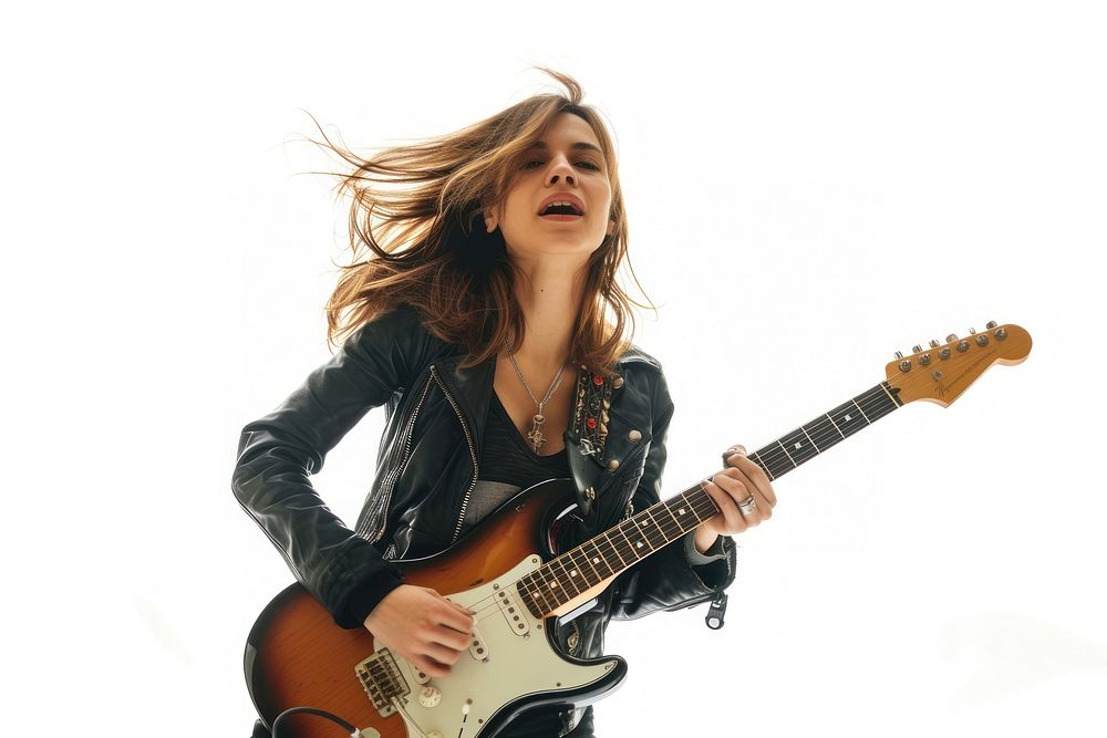 Playing her guitar and singing at a rock or pop musician performer female.