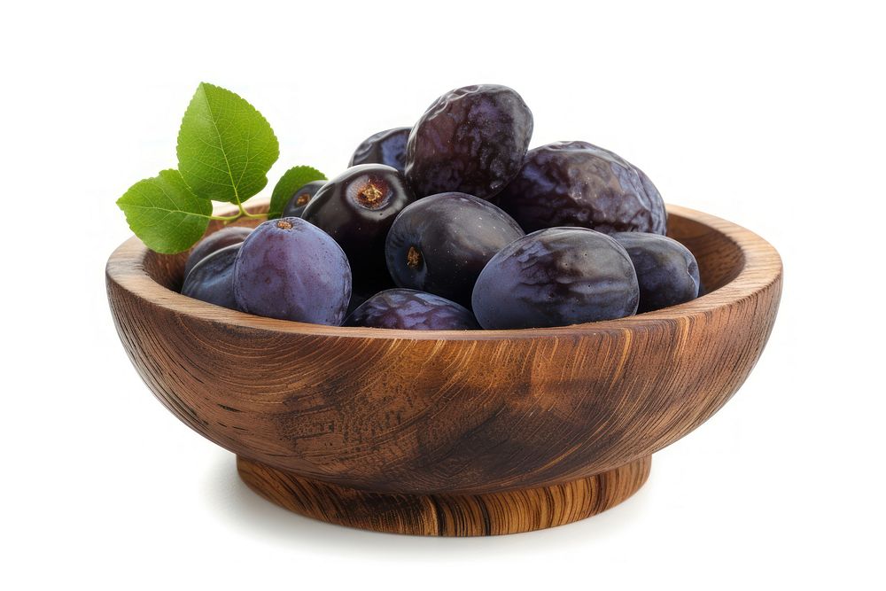 Fresh prunes in wooden bowl fruit plant food.