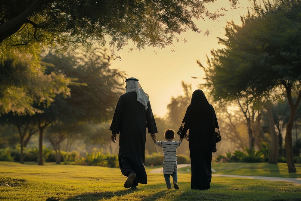 Arabian family walking adult hand.