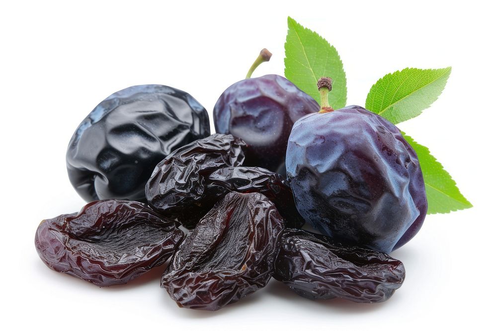 Prunes dried fruit plant food white background.