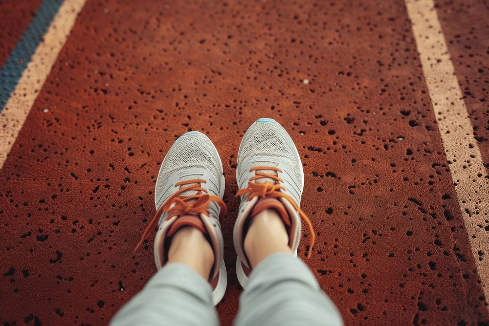 Women in a pair of sneakers on a track shoe footwear white.