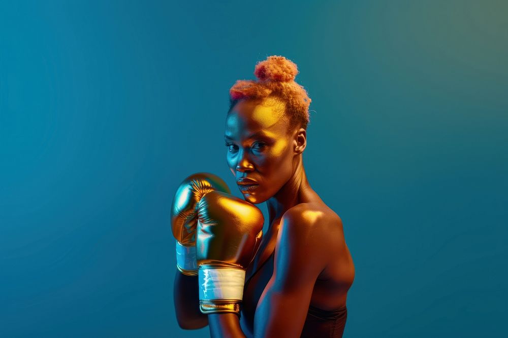 Women professional boxer Wearing golden shining Boxing Gloves portrait adult photography.