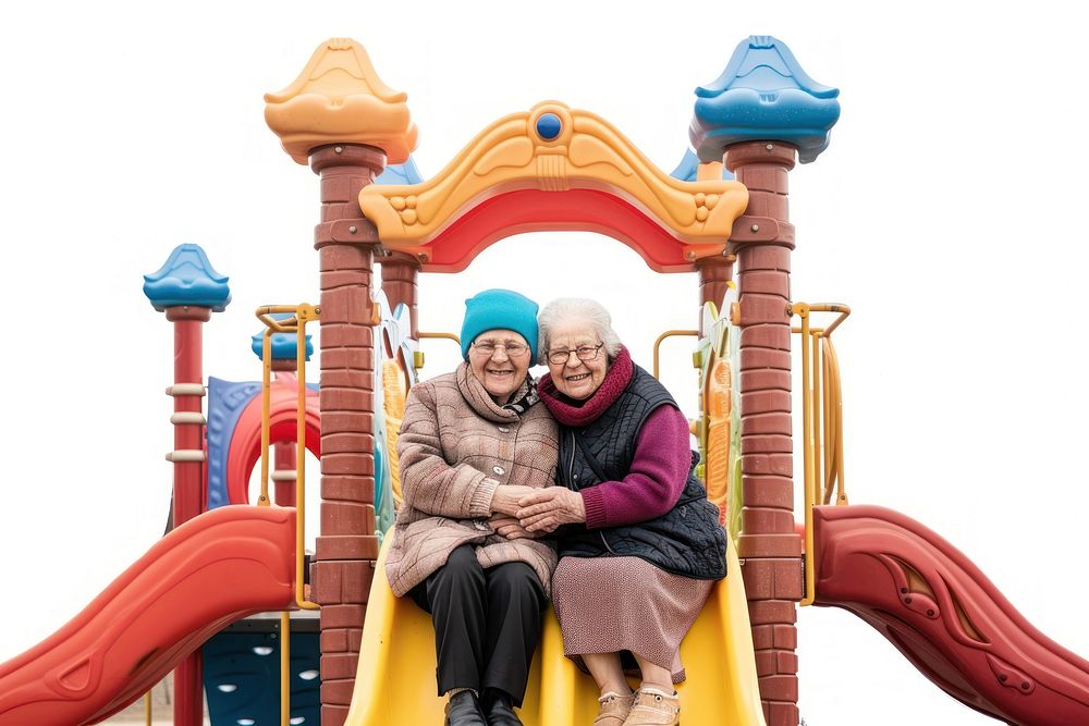Two old women hugging at the playground outdoors slide adult.
