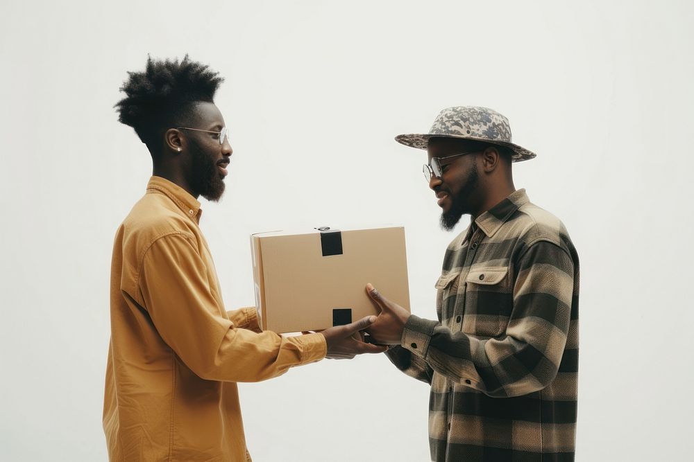 Two black people sending one package cardboard adult white background.
