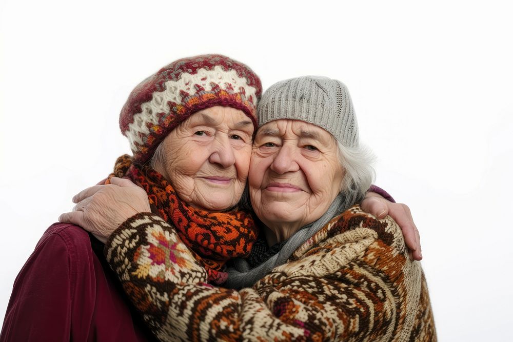 Two elder women hugging portrait adult white background.