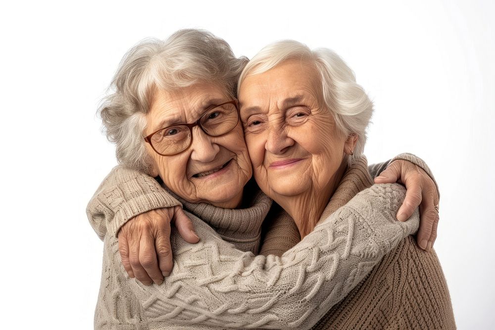 Two elder women hugging sweater adult white background.