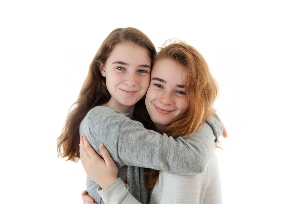 Two young women hugging portrait adult smile.