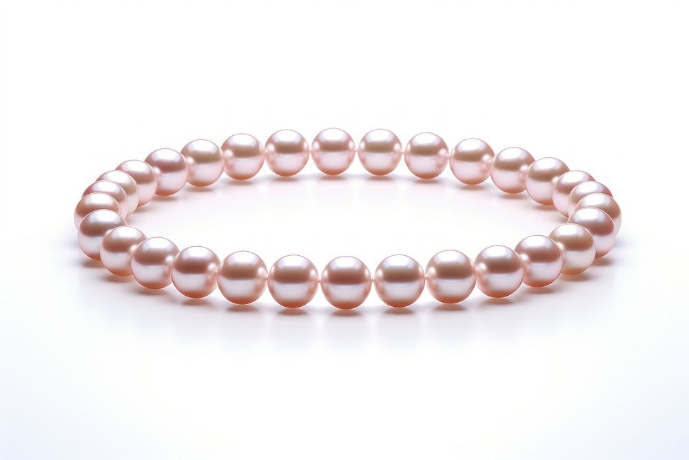 String of pearl necklace bracelet jewelry white background.