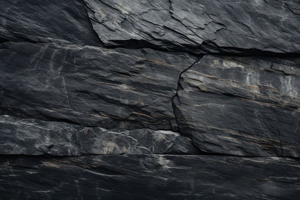 Black granite outdoors rock wall.