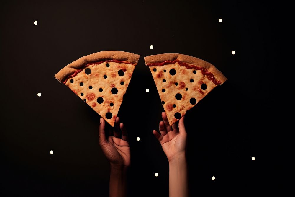 Person holding pizza bread night food.