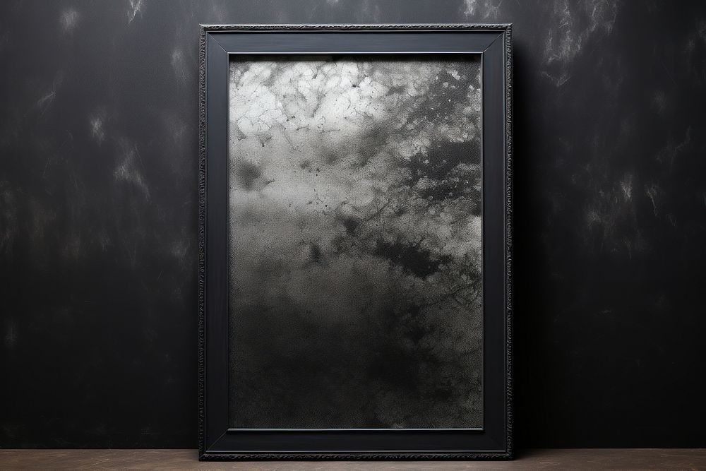 Mirror frame textured black architecture.