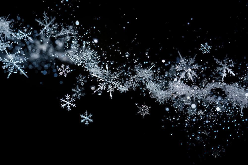 Sprinkle snowflake stream backgrounds black background illuminated.