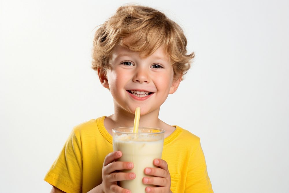 Boy drinking banana smoothie portrait smile photo.
