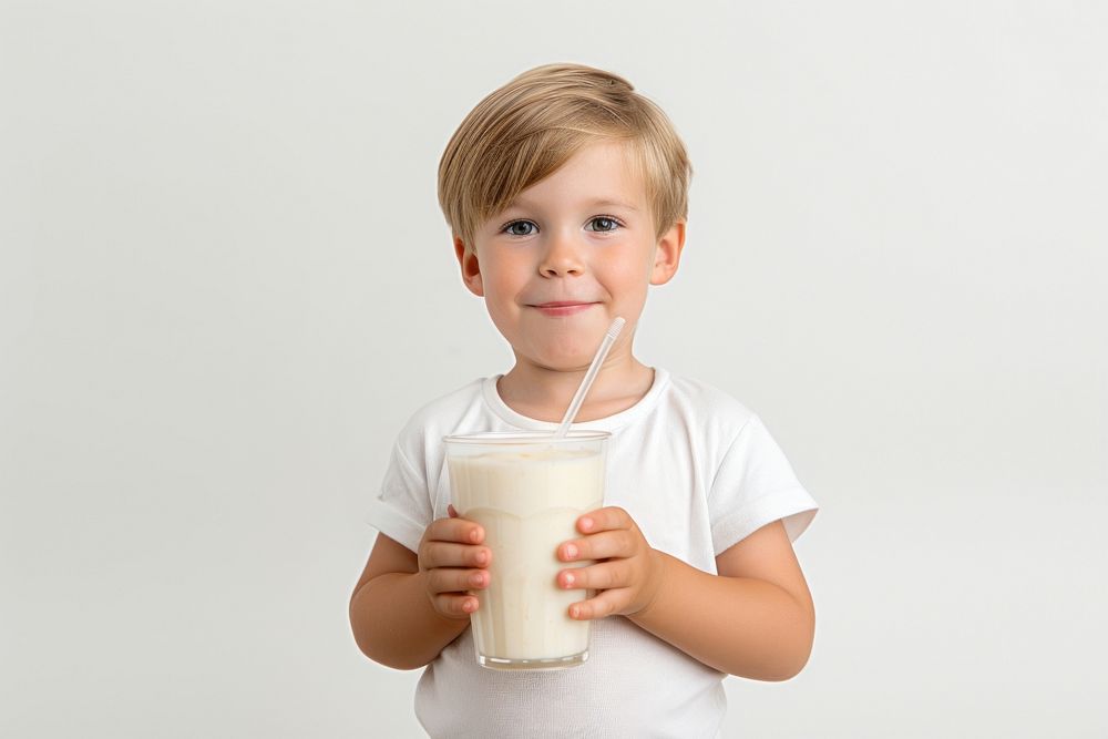 Boy drinking banana smoothie portrait photo milk.