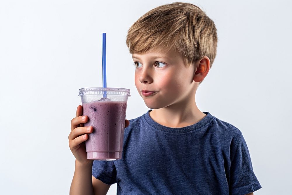Boy drinking blueberry smoothie juice child milk.