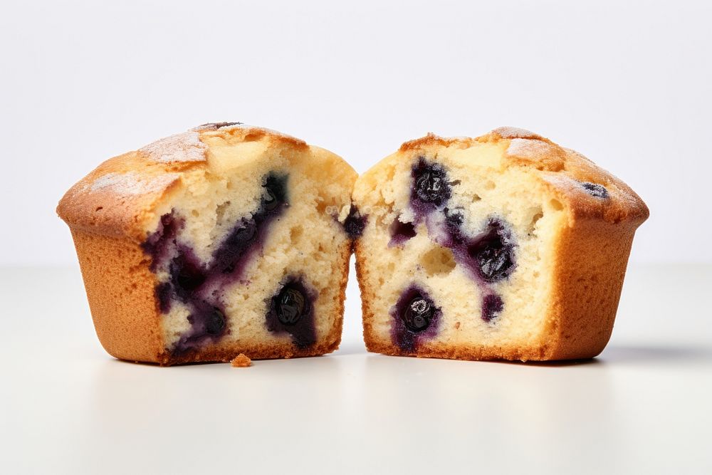 Blueberry muffin cut in half dessert food freshness.
