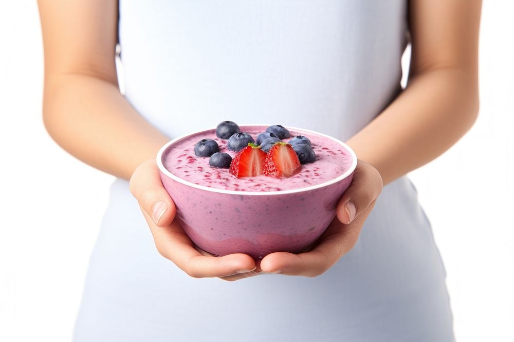 Girl holding blueberry smoothie bowl dessert fruit food.