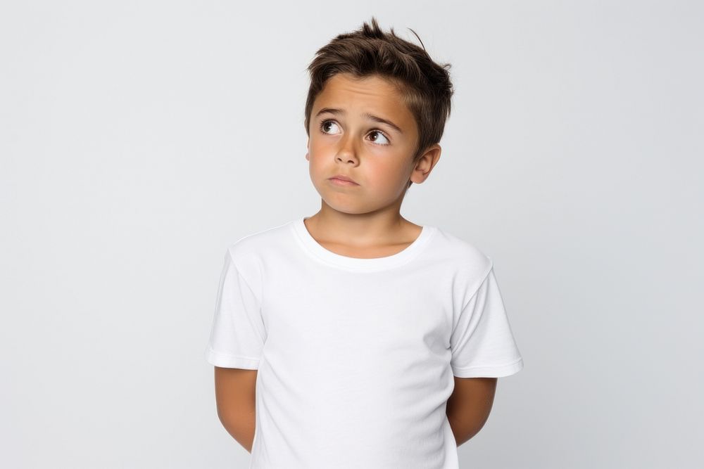 Kid with confused face portrait t-shirt sleeve.