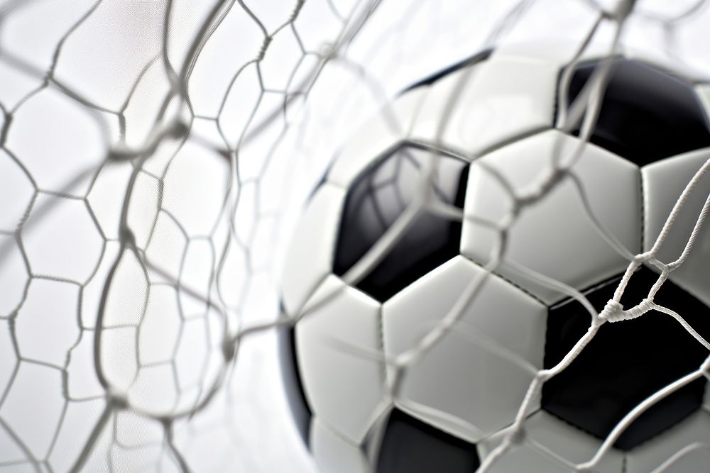 Soccer ball inside goal net backgrounds football sports.