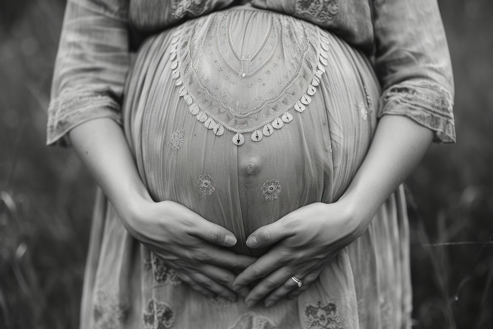 Pregnant woman holding her belly hand adult anticipation.