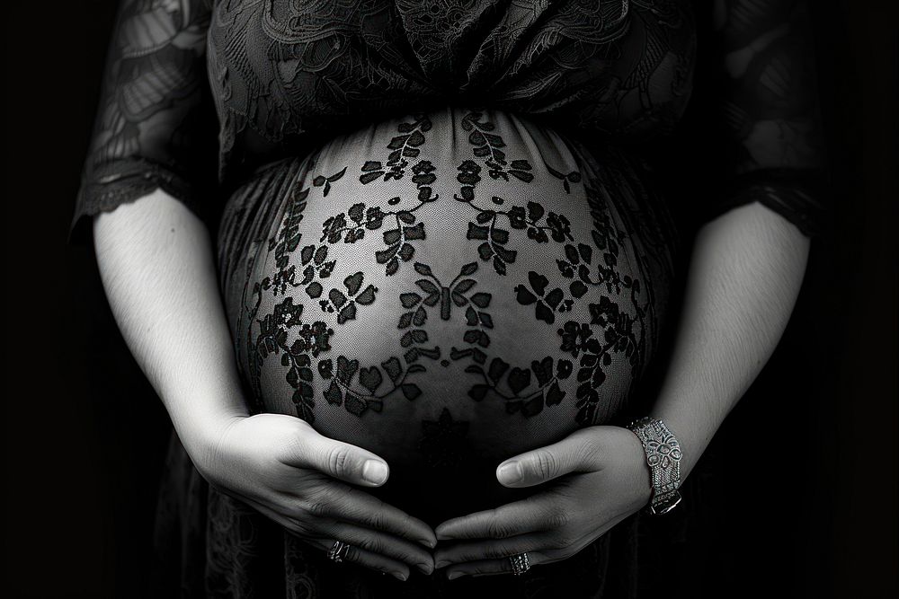 Pregnant woman holding her belly hand anticipation beginnings.