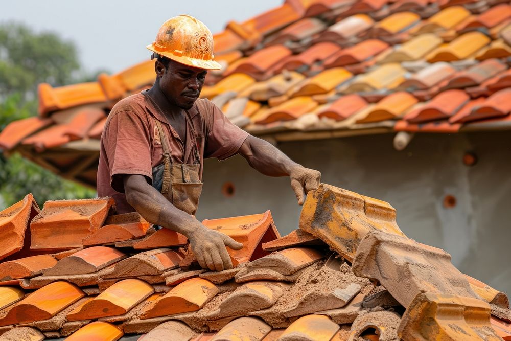 Roof contractor installing roof tile hardhat helmet adult.