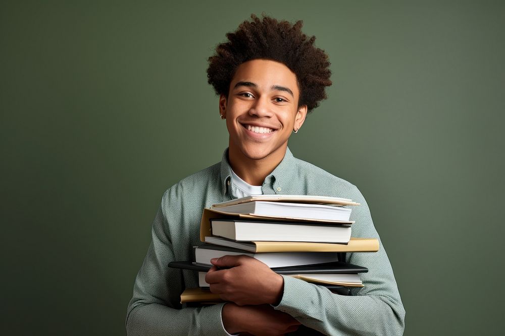 African American student reading holding smile.