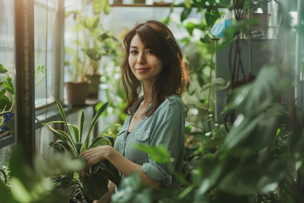 Woman standing in a greenhouse plant adult agriculture.