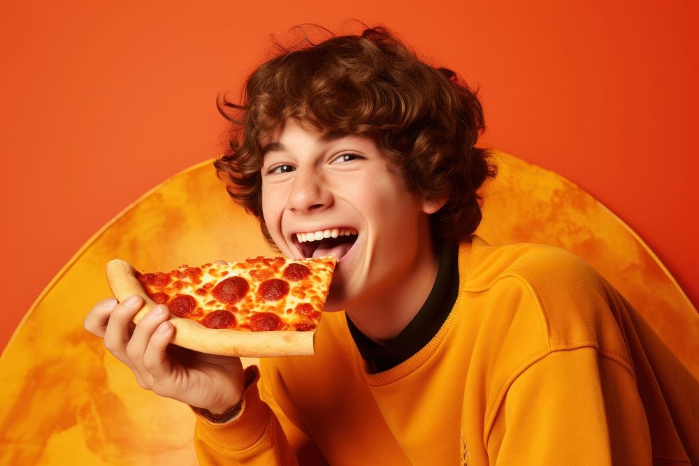 Person holding pizza pepperoni biting eating.