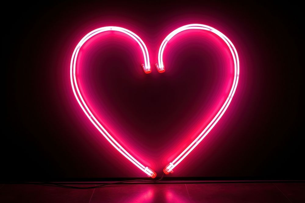 Heart neon sign light glowing illuminated.